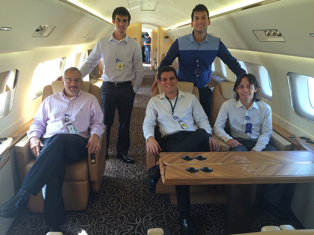 Bruno inside a luxury aircraft with the Embraer team